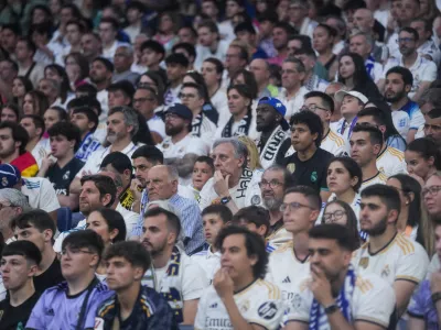 Real Madrid fans watch on screens at Santiago Bernabeu stadium the Champions League final soccer match between Real Madrid and Borussia Dortmund, in Madrid, Spain, Saturday, June 1, 2024. (AP Photo/Paul White)