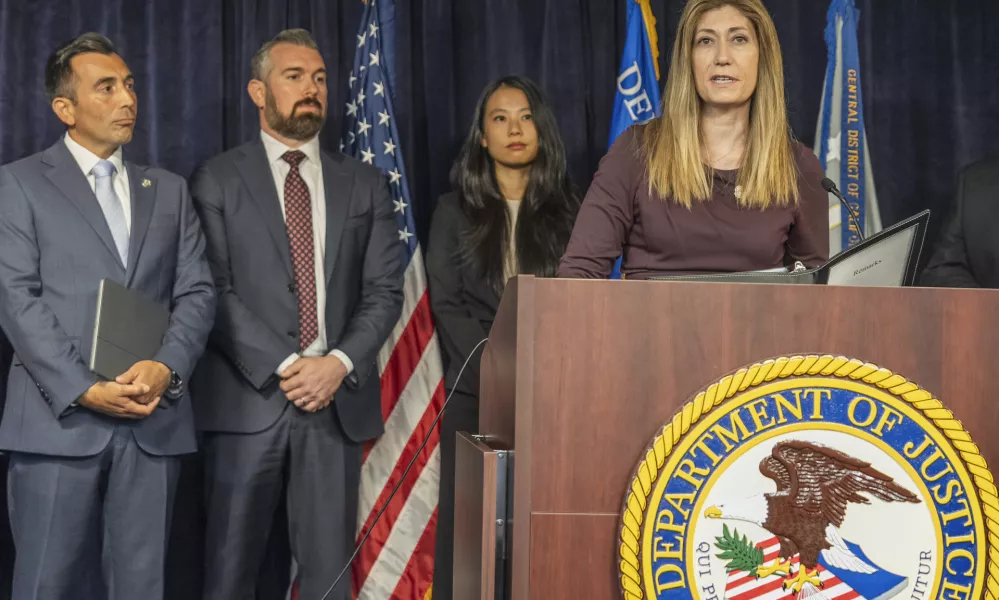 DEA Administrator Anne Milgram, at podium, joins U.S. Attorney Martin Estrada, far left, to announce five people have been charged in connection with Matthew Perry's death at a news conference in Los Angeles on Thursday, Aug. 15, 2024. (AP Photo/Damian Dovarganes)