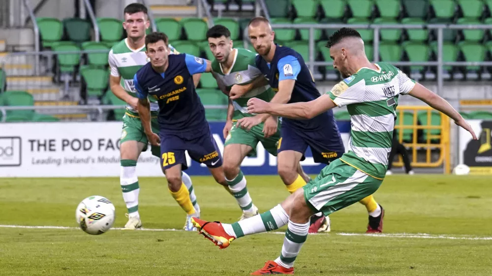 Shamrock Rovers' Dylan Watts scores their side's first goal of the game from the penalty spot, during the Europa League third qualifying round, 2nd leg soccer match against NK Celje, at Tallaght Stadium, in Dublin, Thursday, Aug. 15, 2024. (Brian Lawless/PA via AP)