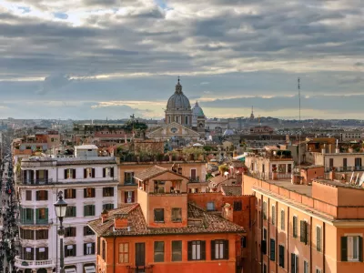 CCA2DT Over the roofs of Rome, view from the church Trinita dei Monti at the center of the bustling metropolis with its domes and roofs