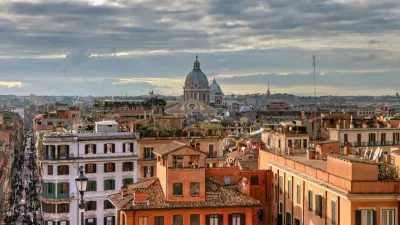 CCA2DT Over the roofs of Rome, view from the church Trinita dei Monti at the center of the bustling metropolis with its domes and roofs