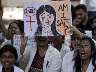 Resident doctors and medical students stage a protest against the alleged rape and killing of a doctor, at Kolkata's RG Kar Medical College and Hospital in Mumbai, India, Saturday, Aug. 17, 2024. (AP Photo/Rajanish Kakade)