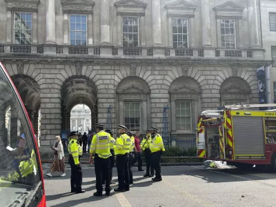 Emergency services outside Somerset House in central London. Saturday Aug. 17, 2024, after a fire broke out the large neoclassical arts venue. (Pol Allingham/PA via AP)