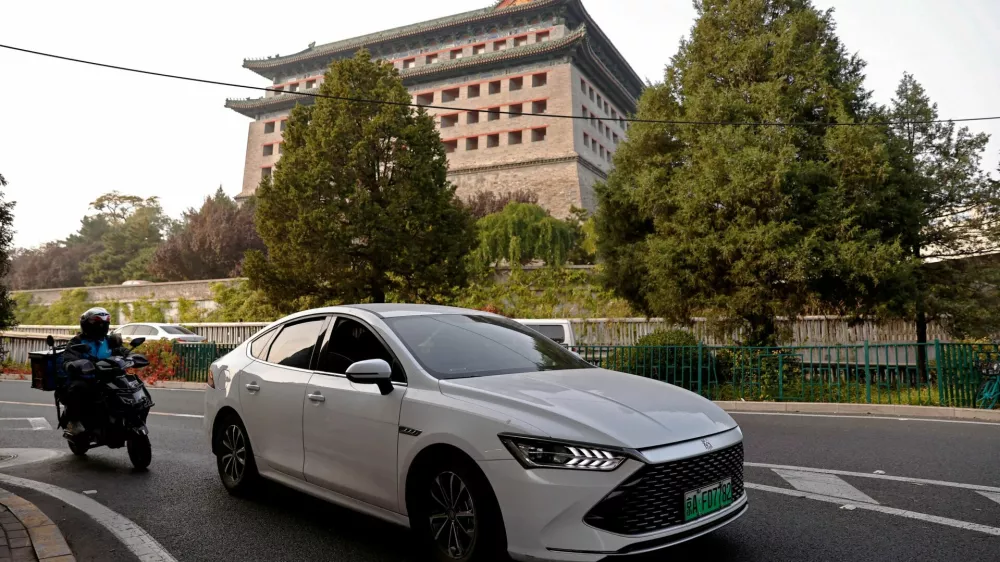 FILE PHOTO: FILE PHOTO: A BYD's electric vehicle (EV) Qin moves on a street in Beijing, China October 31, 2023. REUTERS/Tingshu Wang/File Photo/File Photo