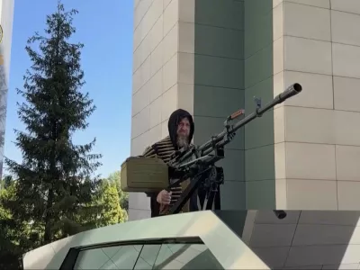 In this image from video posted by Chechen leader Ramzan Kadyrov's Telegram channel on Saturday, Aug. 17, 2024, Kadyrov stands with a machine gun mounted on a Tesla Cybertruck in Grozny, Chechnya. (Ramzan Kadyrov Telegram channel via AP)