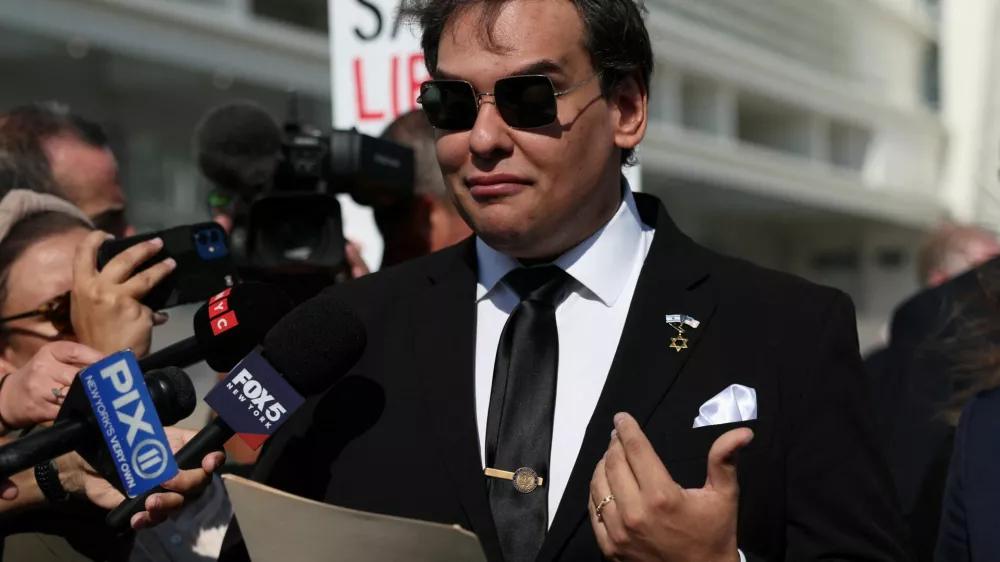 George Santos, who was expelled from the U.S. House of Representatives, reads a statement after pleading guilty to criminal corruption charges at Central Islip Federal Courthouse in Central Islip, New York, U.S., August 19, 2024. REUTERS/Shannon Stapleton