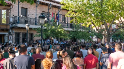 18 August 2024, Spain, Mocejon: People take part in the minute of silence for the murder of a minor at the door of the Mocejon Town Hall. The Mocejon City Council has ordered three days of national mourning for the murder of an 11-year-old minor who was playing soccer this morning with other children on the municipal soccer pitch "Angel Tardio" when he was attacked with a sharp object. Photo: Juan Moreno/EUROPA PRESS/dpa