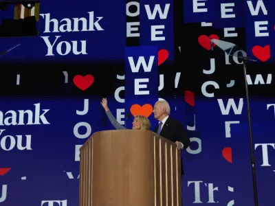 President Joe Biden and first lady Jill Biden stand on stage during the first day of Democratic National Convention, Monday, Aug. 19, 2024, in Chicago. (AP Photo/Jacquelyn Martin)