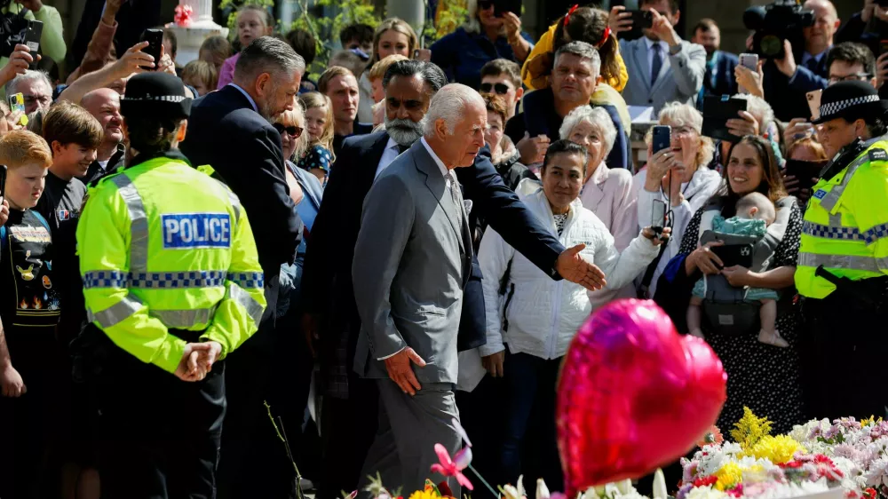 Britain's King Charles walks, as he makes a community visit, outside the Town Hall in Southport, Britain, August 20, 2024. REUTERS/Temilade Adelaja