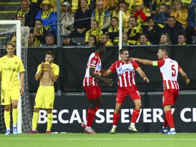 Belgrade's Ognjen Mimovic celebrates after scoring his side's first goal during the Champions League first leg play-off match between Bodø/Glimt and Crvena Zvezda (Red Star Belgrade) at the Aspmyra stadium in Bodø, Norway, Tuesday, Aug. 20, 2024. (Mats Torbergsen/NTB Scanpix via AP)