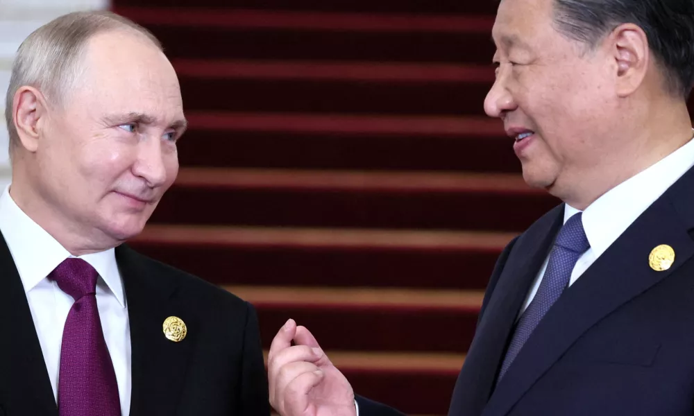 FILE PHOTO: Russian President Vladimir Putin speaks with Chinese President Xi Jinping during a welcoming ceremony at the Belt and Road Forum in Beijing, China, October 17, 2023. Sputnik/Sergei Savostyanov/Pool via REUTERS ATTENTION EDITORS - THIS IMAGE WAS PROVIDED BY A THIRD PARTY./File Photo