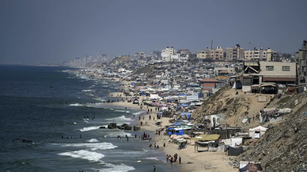 Tents are crammed together as displaced Palestinians camp on the beach, west of Deir al-Balah, Gaza Strip, Tuesday, Aug. 20, 2024. (AP Photo/Abdel Kareem Hana)