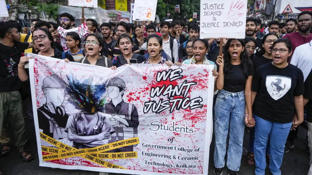 Engineers and engineering students attend a protest against the rape and killing of a trainee doctor at a government hospital, in Kolkata, India, Wednesday, Aug. 21, 2024. India's top court on Tuesday set up a national task force of doctors who will make recommendations on safety of health care workers at their workplace, days after the rape and killing of a trainee doctor that sparked outrage and nationwide protests. (AP Photo/Bikas Das)