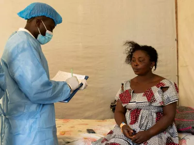 Nyota Mukobelwa is assessed by a medical worker at the health centre where she is undergoing treatment against Mpox, an infectious disease caused by the Mpox virus that causes a painful rash, enlarged lymph nodes and fever, in Munigi, Nyiragongo territory, near Goma in North Kivu province of the Democratic Republic of Congo August 19, 2024. REUTERS/Arlette Bashizi