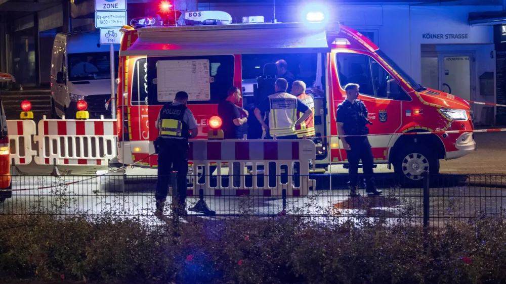 Emergency services and police are deployed near the scene where people were killed and injured in an attack at a festival in Solingen, western Germany, the German dpa news agency reported, Friday, Aug. 23, 2024. (Gianni Gattus/dpa via AP)