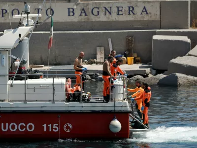 Rescue personnel transport what is believed to be the body of Hannah Lynch, daughter of British tech entrepreneur Mike Lynch, at the scene where a luxury yacht sank, off the coast of Porticello, near the Sicilian city of Palermo, Italy, August 23, 2024. REUTERS/Louiza Vradi