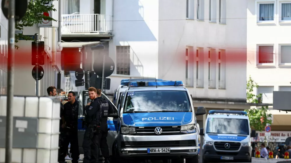 Police officers stand following an incident in which several individuals were killed after a man randomly stabbed passers-by with a knife at a city festival, in Solingen, Germany, August 24, 2024. REUTERS/Thilo Schmuelgen