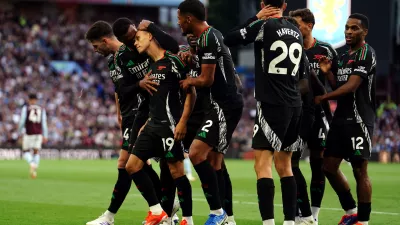 24 August 2024, United Kingdom, Birmingham: Arsenal's Leandro Trossard (3rd L) celebrates scoring his side's first goal with teammates during the English Premier League soccer match between Aston Villa and Arsenal at Villa Park. Photo: David Davies/PA Wire/dpa