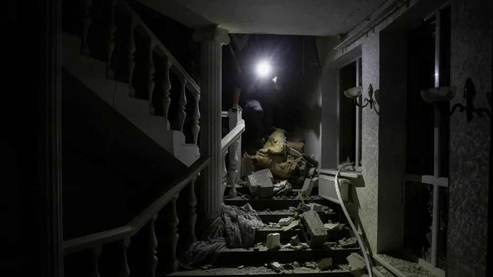 A man walks on stairs among debris inside a hotel hit by a Russian missile strike, amid Russia's attack on Ukraine, in Kramatorsk, Donetsk region, Ukraine August 24, 2024. REUTERS/Thomas Peter