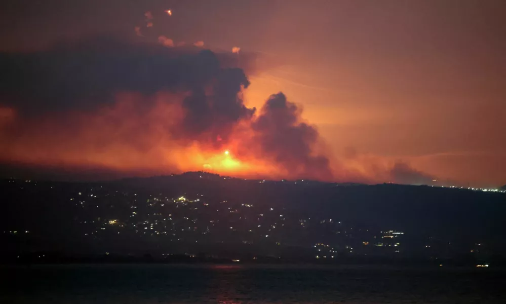 A view shows smoke and fire on the Lebanese side of the border with Israel, after Israel said it had noted armed group Hezbollah preparing to attack Israel and had carried out pre-emptive strikes on Hezbollah targets in Lebanon, as seen from Tyre, southern Lebanon August 25, 2024. REUTERS/Aziz Taher   TPX IMAGES OF THE DAY