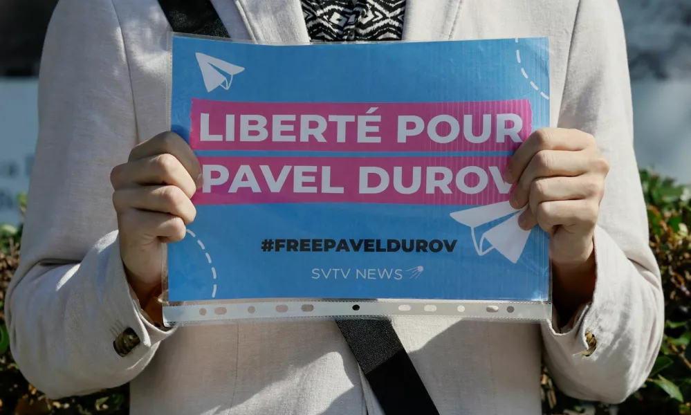 A participant of a one-person picket demonstrates a placard to bring attention to the arrest of Pavel Durov, founder and CEO of the Telegram messaging app, near the French embassy in Moscow, Russia August 25, 2024. A slogan on the placard reads: "Freedom for Pavel Durov". REUTERS/Yulia Morozova