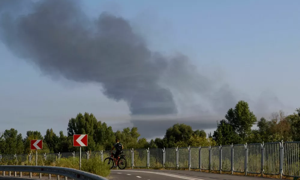 Smoke rises from the city's outskirts during a Russian missile and drone strike, amid Russia's attack on Ukraine, in Kyiv, Ukraine August 26, 2024. REUTERS/Vladyslav Musiienko