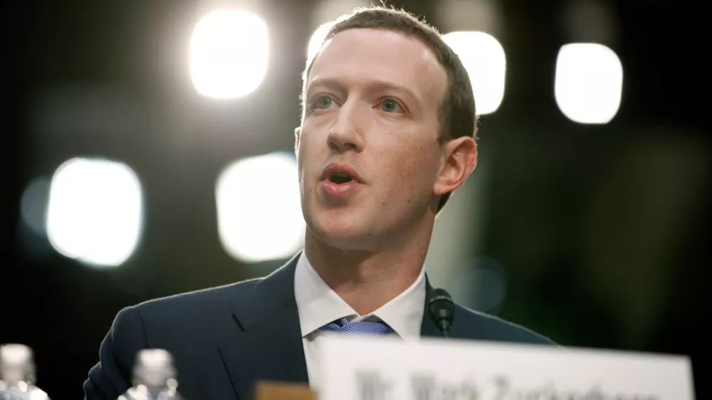 FILE - Facebook CEO Mark Zuckerberg testifies before a joint hearing of the Commerce and Judiciary Committees on Capitol Hill in Washington, April 10, 2018, about the use of Facebook data to target American voters in the 2016 election. Zuckerberg, who was back in damage control mode on Wednesday, Jan. 31, 2024, when he apologized to the parents of children exploited, bullied or driven to self harm via social media, has accumulated a long history of public apologies, often issued in the wake of crisis or when Facebook users rose up against unannounced changes in its service. (AP Photo/Alex Brandon, File)