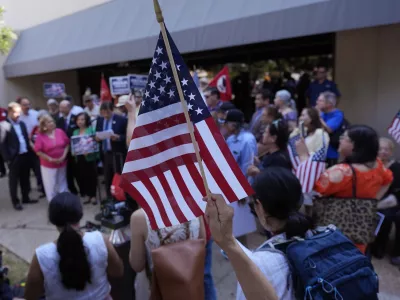 Supporters attend a news conference where officials with the League of United Latin American Citizens, or LULAC, held a news conference to respond to allegations by Texas Attorney General Ken Paxton, Monday, Aug. 26, 2024, in San Antonio. (AP Photo/Eric Gay)