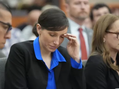 Kouri Richins, a Utah mother of three who wrote a children's book about coping with grief after her husband's death and was later accused of fatally poisoning him, looks on during a hearing Tuesday, Aug. 27, 2024, in Park City, Utah. (AP Photo/Rick Bowmer, Pool)