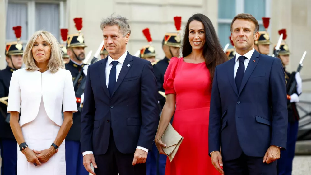 French President Emmanuel Macron and his wife Brigitte Macron welcome Slovenia's Prime Minister Robert Golob and his partner Tina Gaber as they arrive to attend a reception for heads of state and government at the Elysee Palace before the opening ceremony of the Paris 2024 Paralympic Games, in Paris, France August 28, 2024. REUTERS/Sarah Meyssonnier