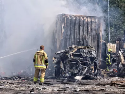 FILED - 26 August 2024, Ukraine, Odesa: Rescuers stand by the cars of a transport company destroyed by the massive Russian missile and drone attack. Photo: -/Ukrinform/dpa