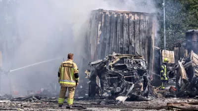 FILED - 26 August 2024, Ukraine, Odesa: Rescuers stand by the cars of a transport company destroyed by the massive Russian missile and drone attack. Photo: -/Ukrinform/dpa