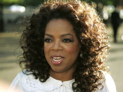 FILE - In this June 25, 2008 file photo, U.S. television presenter Oprah Winfrey arrives for the dinner birthday party of former president of South Africa Nelson Mandela in central London's Hyde Park. Winfrey has settled a defamation lawsuit filed by the ex-headmistress of her girls school in South Africa, lawyers said Tuesday March 23, 2010. The lawsuit by former headmistress Nomvuyo Mzamane claimed Winfrey defamed her in remarks made in the wake of a 2007 sex-abuse scandal at the school. (AP Photo/Lefteris Pitarakis, File)