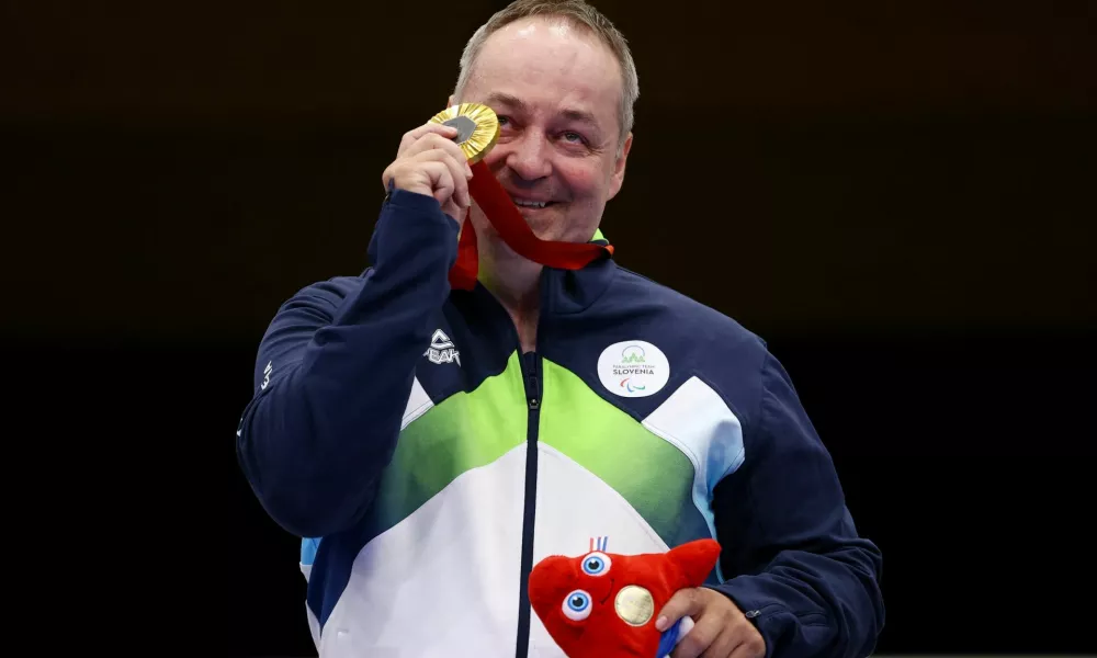 Paris 2024 Paralympics - Shooting - R4 - Mixed 10m Air Rifle Standing SH2 Final - Chateauroux Shooting Centre, Deols, France - August 30, 2024 Gold medallist Francek Gorazd Tirsek of Slovenia celebrates after the final REUTERS/Eng Chin An