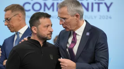 FILE PHOTO: Ukrainian President Volodymyr Zelenskiy speaks to the Nato Secretary General Jens Stoltenberg before the first plenary session at the European Political Community meeting at Blenheim Palace in Woodstock, Britain, Thursday, July 18, 2024. Kin Cheung/Pool via REUTERS/File Photo