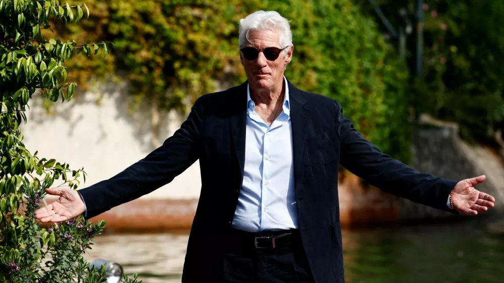 Actor Richard Gere gestures as he arrives during the 81st Venice Film Festival, in Venice, Italy, September 1, 2024. REUTERS/Yara Nardi