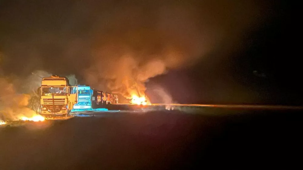 A view shows grain trucks which were hit by a Russian missile strike, amid Russia's attack on Ukraine, in Sumy region, Ukraine, in this handout picture released September 1, 2024. Press service of the National Police of Ukraine/Handout via REUTERS ATTENTION EDITORS - THIS IMAGE HAS BEEN SUPPLIED BY A THIRD PARTY. DO NOT OBSCURE LOGO. BEST QUALITY AVAILABLE.