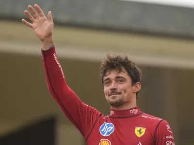 Ferrari driver Charles Leclerc of Monaco celebrates on the podium after the Formula One Italian Grand Prix race at the Monza racetrack, in Monza, Italy, Sunday, Sept. 1, 2024. (AP Photo/Luca Bruno)