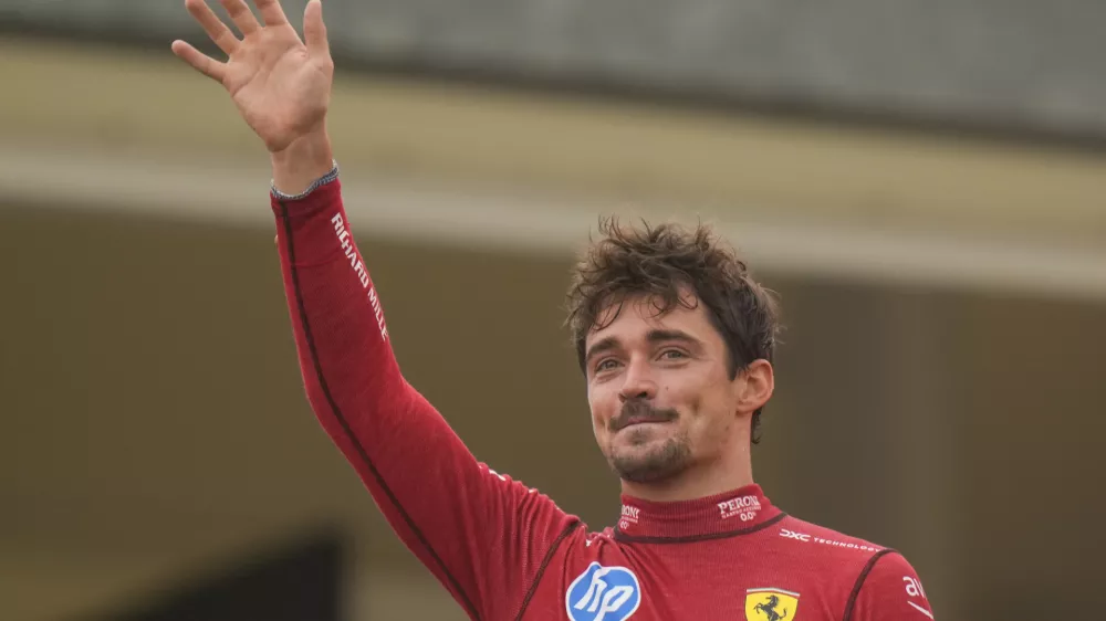 Ferrari driver Charles Leclerc of Monaco celebrates on the podium after the Formula One Italian Grand Prix race at the Monza racetrack, in Monza, Italy, Sunday, Sept. 1, 2024. (AP Photo/Luca Bruno)