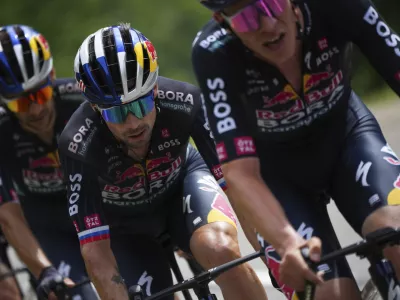 Slovenia's Primoz Roglic rides during the fourth stage of the Tour de France cycling race over 139.6 kilometers (86.7 miles) with start in Pinerolo, Italy and finish in Valloire, France, Tuesday, July 2, 2024. (AP Photo/Daniel Cole)