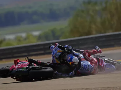 Spain's rider Alex Marquez of the Gresini Racing MotoGP, right and Italian rider Francesco Bagnaia of the Ducati Lenovo Team collide during the MotoGP race at the Aragon Motorcycle Grand Prix at the MotorLand Aragon circuit, in Alcaniz, Spain, Sunday, Sept. 1, 2024. (AP Photo/Jose Breton)