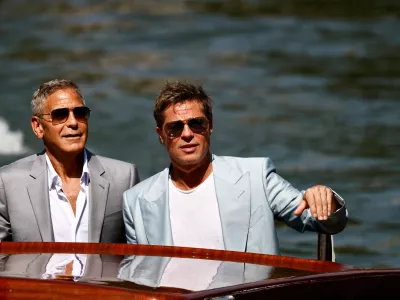 Actors Brad Pitt and George Clooney arrive during the 81st Venice Film Festival, in Venice, Italy, September 1, 2024. REUTERS/Yara Nardi