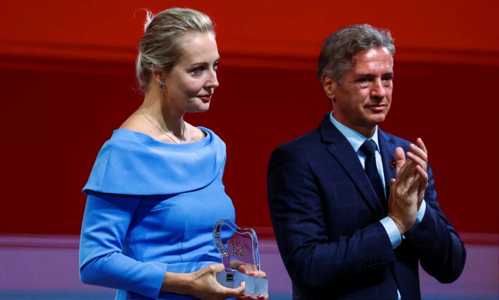 Slovenian Prime Minister Robert Golob applauds next to Yulia Navalnaya, the widow of late Russian opposition leader Alexei Navalny, during the 2024 edition of the Bled Strategic Forum in Slovenia, September 2, 2024. REUTERS/Borut Zivulovic