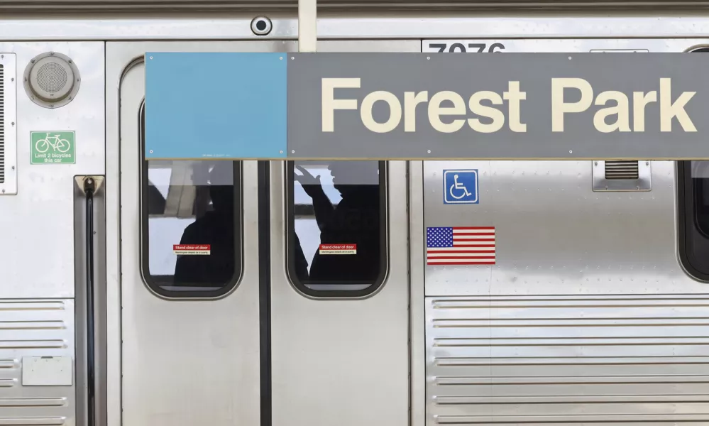 Police investigators work inside a CTA Blue Line train parked at the Forest Park station after a shooting, Monday, Sept. 2, 2024, in Forest Park, Ill. (John J. Kim/Chicago Tribune via AP)