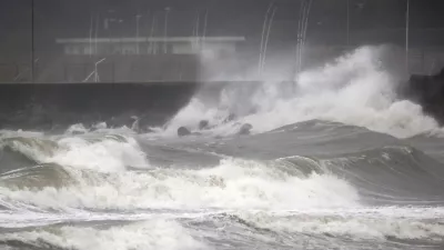 High waves hit the shore in Miyazaki, southern Japan, Sunday, Sept. 18, 2022, as a powerful typhoon approaching southern Japan on Sunday lashed the region with strong winds and heavy rain.(Kyodo News via AP)