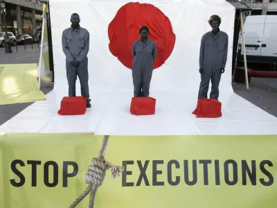 On World Day Against the Death Penalty, activists of Amnesty International, demonstrate with a noose around their neck in front of the Japanese embassy in Brussels, Friday, Oct.10, 2008. Amnesty International has called for the Japanese government to immediately adopt a moratorium on executions. The protesters are painted black symbolizing a black spot on the Japanese flag. (AP Photo/Yves Logghe)