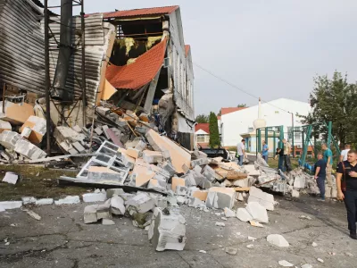 02 September 2024, Ukraine, Kiev: People inspect the damaged building after the Russian missile attack on the premises of the lyceum of the Interregional Academy of Personnel Management. Photo: -/Ukrinform/dpa