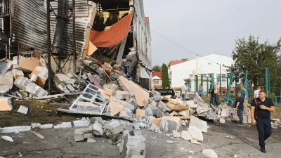 02 September 2024, Ukraine, Kiev: People inspect the damaged building after the Russian missile attack on the premises of the lyceum of the Interregional Academy of Personnel Management. Photo: -/Ukrinform/dpa