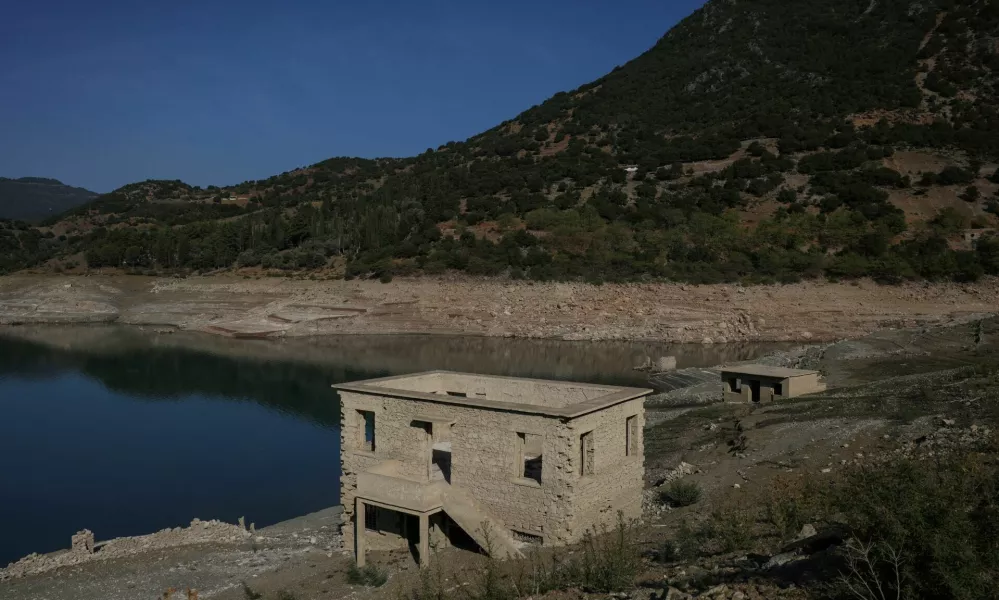 The reappearing remains of buildings of the village of Kallio, which was intentionally flooded in 1980 to create a reservoir that would help meet the water needs of Greek capital Athens, are seen following receding water levels caused by drought, in Lake Mornos, Greece, September 3, 2024. REUTERS/Stelios Misinas