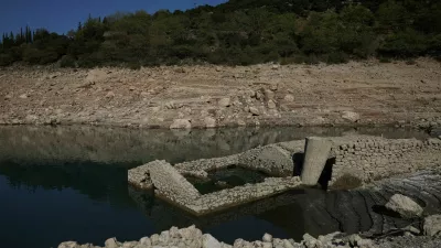 The reappearing remains of a building of the village of Kallio, which was intentionally flooded in 1980 to create a reservoir that would help meet the water needs of Greek capital Athens, are seen following receding water levels caused by drought, in Lake Mornos, Greece, September 3, 2024. REUTERS/Stelios Misinas